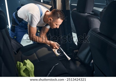 Similar – Image, Stock Photo Middle-aged man thoroughly cleans a tablet computer