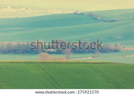 Rolling hills with fields in sunset light suitable for backgrounds or wallpapers.Vintage filter instagram.