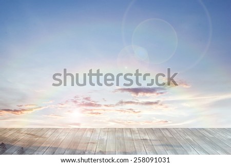 old wooden texture and double twin rainbow with lens flare in blue sky background