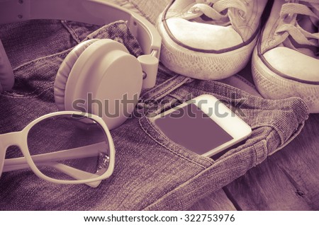 accessory jeans smart devices, glasses on a wooden floor tone vintage