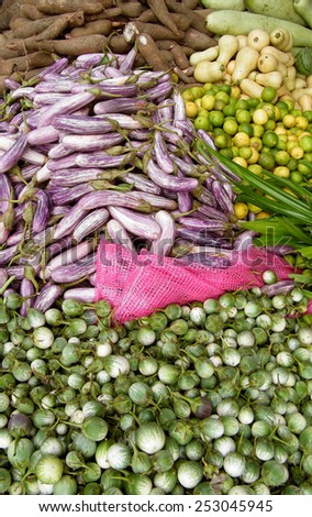 Various kind of fresh green vegetables (Egg plant, Brinjol, limes) at market