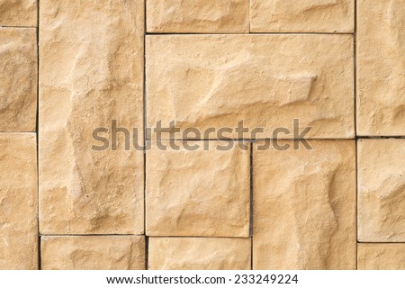 Close up of light brown rock cemented with wall for texture and interior background