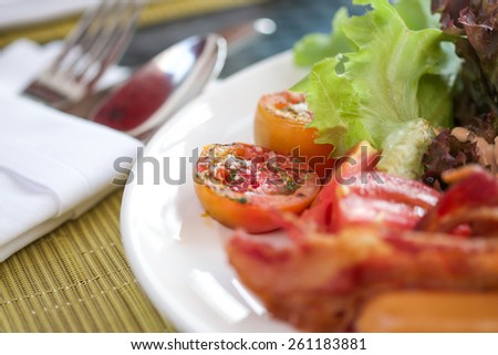 Fresh vegetable salad with bacon and sausage for breakfast or light meal background