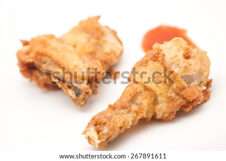 Close up of delicious and crispy chicken drum stick on white for food background