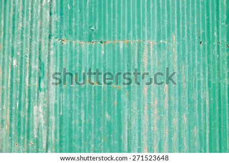 Old green rustic metal sheet or plate for barrier and construction background