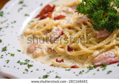 Close up of delicious Italian spaghetti on white ceramic plate for food background