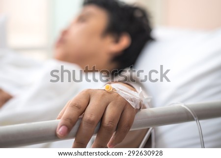 Sick patient lying on bed in hospital for medical background