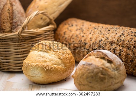 Freshly baked french whole wheat bread and roll with wood texture for healthy breakfast diet