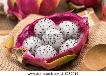 Fresh and sweet dragon fruit crafted in balls for dessert serving, Thai fruit background