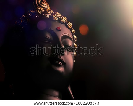 edited image of laughing buddha idol with abstract and glow lights/peaceful smiling buddha statue with focus on subject/background image of laughing buddha/isolated face of a smiling buddha statue