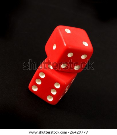 Red dice and black background