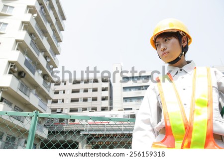 Low angle view of a female traffic cop looking away