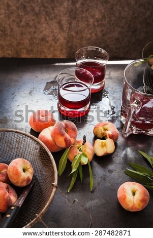 Fresh nectarines (peach) and fresh wine ready to prepare sangria drink. Rustic style.