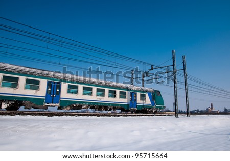 a train passes on a cold winter landscape