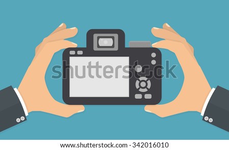 Hand holding digital camera with blank screen. Flat style