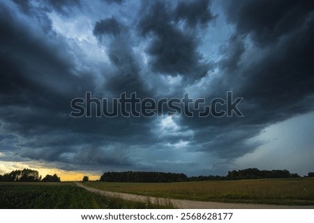 Similar – Image, Stock Photo Eerie cloud formation over the vast land