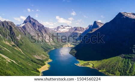 Aerial view on Geiranger town, harbor and fjord in More og Romsdal county in Norway famous for his beautiful boattrip through the fjord.