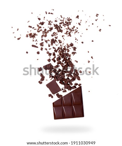 Pieces of chocolate, 
crumbs flying in the air are isolated on an 
white background. The concept of food levitation. Stock fotó © 