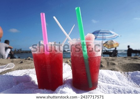 Similar – Image, Stock Photo two straw beach umbrellas on an empty seashore on a clear day