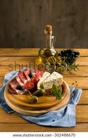 italian snacks on a cutting board
