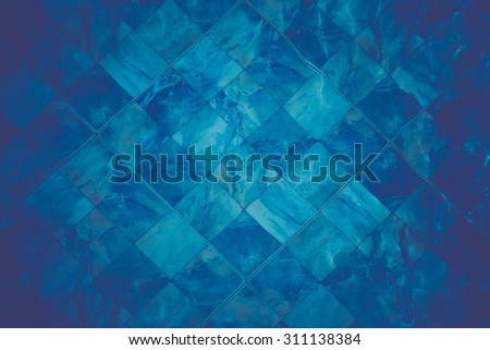 background texture of underwater blue color marble pattern swimming pool tiles