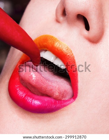 makeup. Expression rock style lip make-up like a vampire, dark romantic. Fashion look, glitter, multicolor, soft focus