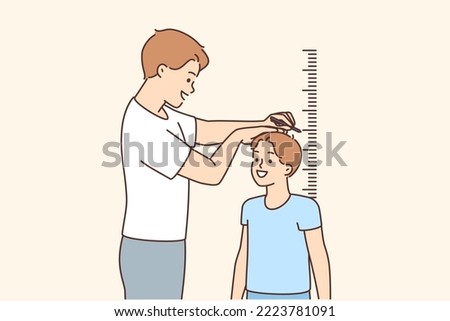 Smiling father measure small son height near wall. Happy dad check little boy child near measurement indoors. Children growing. Vector illustration. 