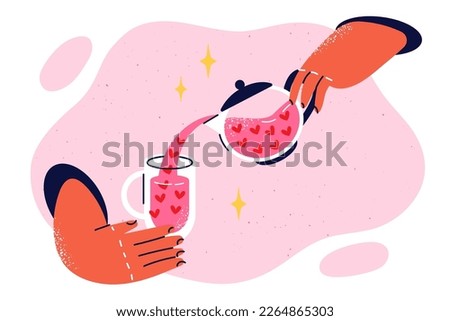 Hands with glass and teapot filled with hearts symbolizing love potion to create love couples with romantic relationship. Delicious drink for romantic date pours from teapot into glass