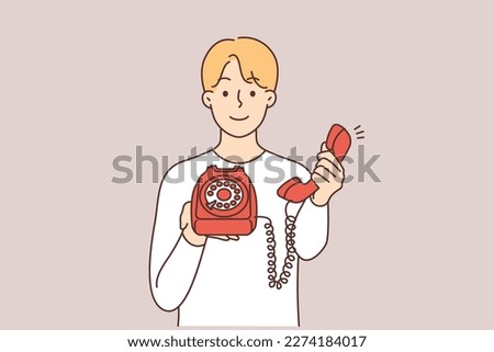 Smiling man holding retro landline phone offer to make call. Happy guy with corded telephone suggest talking. Vector illustration. 