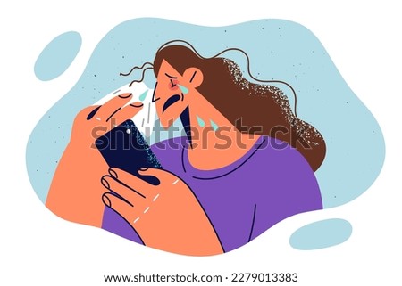 Crying woman wipes tears with handkerchief and holds phone while watching melodrama film or touching video. Girl with phone starts to crying after quarrel with boyfriend in internet chat 