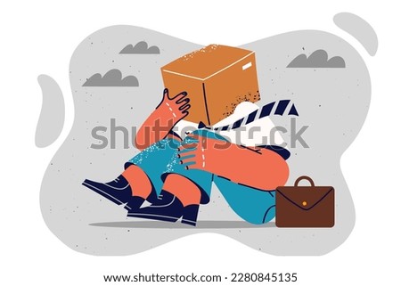 Fallen man with cardboard box on head for concept of disorientation and lack of strategy for company. Man in business clothes sits on ground hiding face behind box and delivery service 