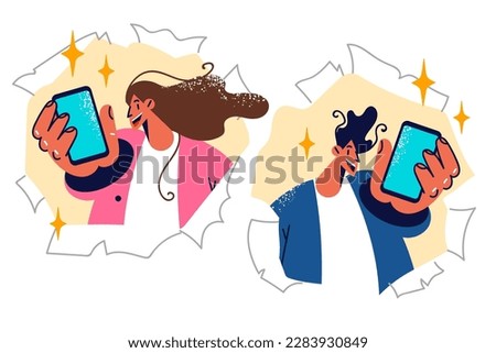 Man and woman show mobile phones to show off cool youth app for chatting or sharing photos. Guy and girl look out of holes in paper to demonstrate smartphone and advise to visit website 