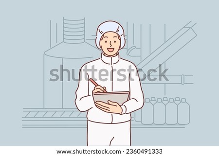 Man chemical factory technologist holding clipboard, standing near industrial equipment for production of detergents. Factory worker producing chemicals or fuels and lubricants for cars