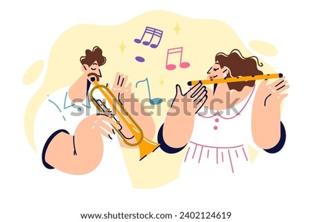 Musical group of man playing trumpet and woman using clarinet performs together on stage. Talented guy and girl are practicing performing classical musical compositions and dream of touring world