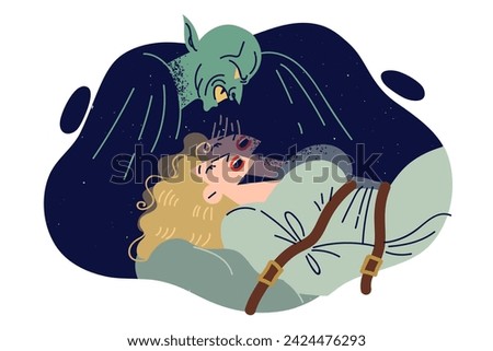 Devil has kidnapped and tied up frightened girl, and sucks soul out of victim in young girl nightmare. Nightmare of female blonde suffering from torture by mythological werewolf in robe