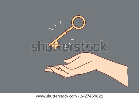 Golden key over woman hand to open safe with money or door to own house bought with mortgage. Golden key as metaphor for problem solving and having good way to solve complex issue.
