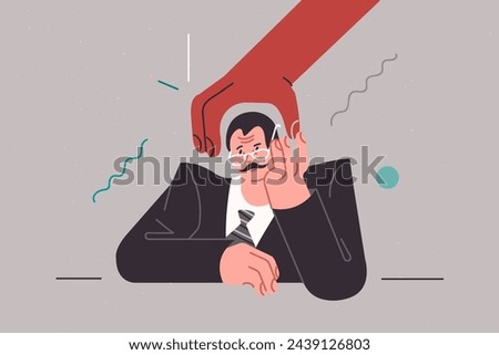 Apathetic business man feeling stressed due to threat of dismissal and job loss, sitting at table near big red hand. Apathetic manager needs time to recuperate after difficult project