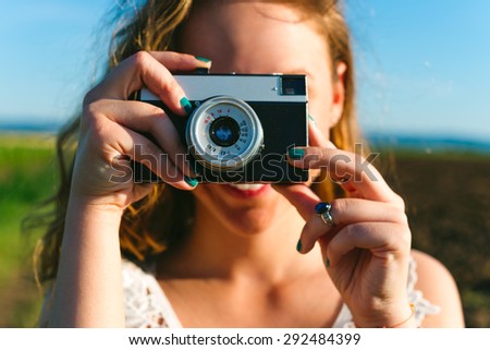 Young Woman with Photo Camera
