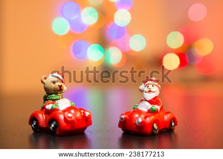 Toy x-mas tree decoration with background of blurry lights