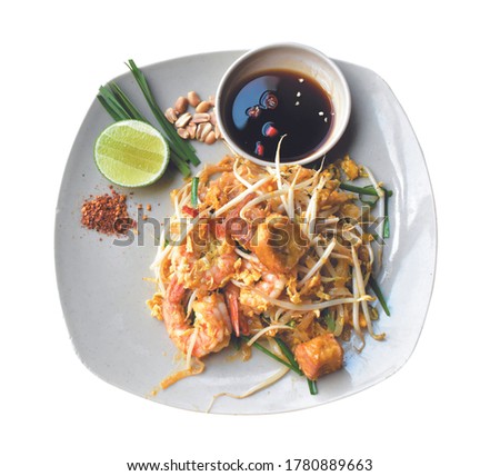 Delicious shrimp Pad Thai noodle white dish with lemon and sauce,  Thailand style, Asian food, o shadow, cooking, top view, white background Zdjęcia stock © 