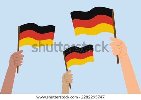 Diverse people's hands holding German flags. Flag of the Germany. Vector illustration in flat style on blue background.