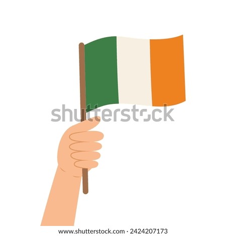 Hand holding a flag of Ireland. Vector illustration of the Irish flag in flat style isolated on while background.