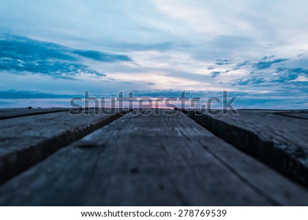unusual foreshortening of the wooden ladder sent to the sunset sky