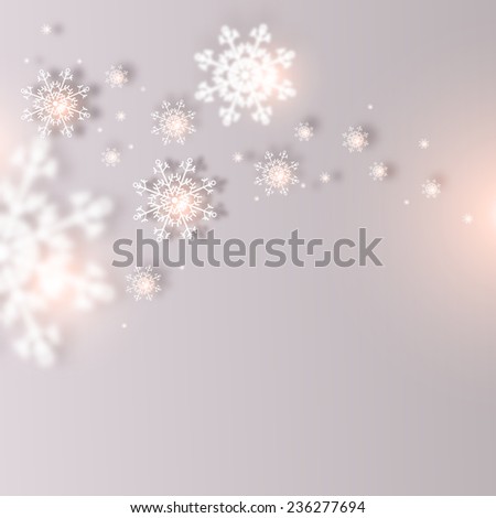 Christmas snowflakes on blurred background with space for text.  Holiday card with space for text