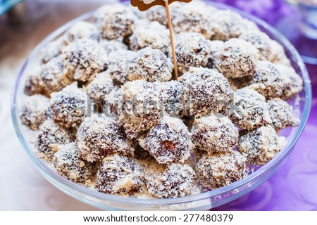 Dessert for holiday. Candy with chocolate, nuts and coconut, cakes and sweetness. Wedding dessert.