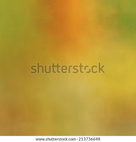 art abstract glass textured blurred background in gold, orange and green colors
