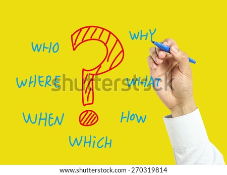 Businessman is drawing questions concept with marker on transparent board with yellow background.