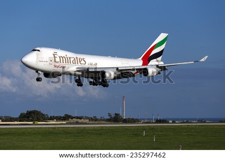 Luqa, Malta December 4, 2014: Emirates SkyCargo (TNT) Boeing 747-4HAF/ER/SCD landing down runway 31.