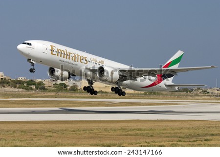 Luqa, Malta July 22, 2007: Emirates Boeing 777-21H lifts off from runway 32.