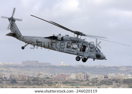 Luqa, Malta September 28, 2009: US Navy Sikorsky MH-60S Knighthawk (S-70A) lifts off for a runway 06 departure.
